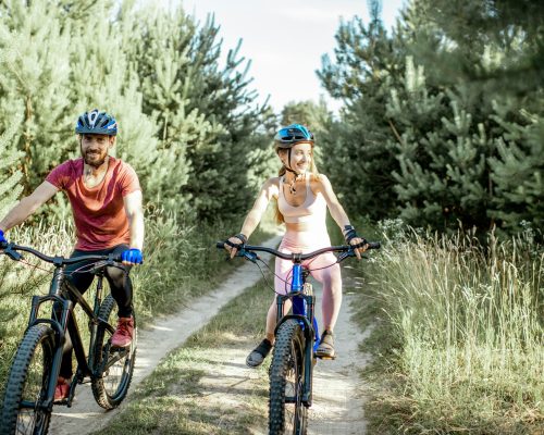 cyclists-riding-mountain-bicycles-outdoors